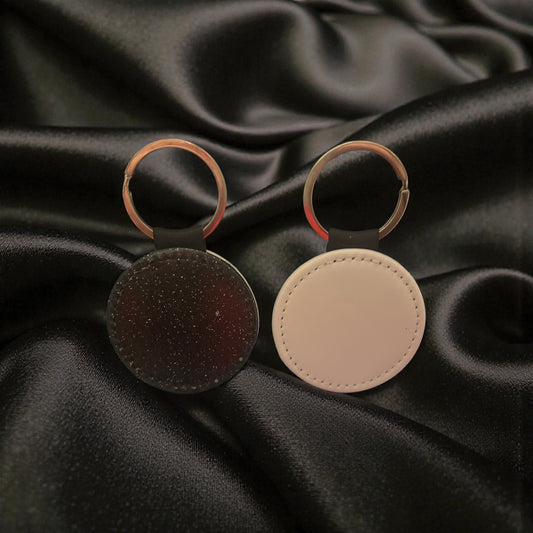 Porte clé rond noir à paillettes